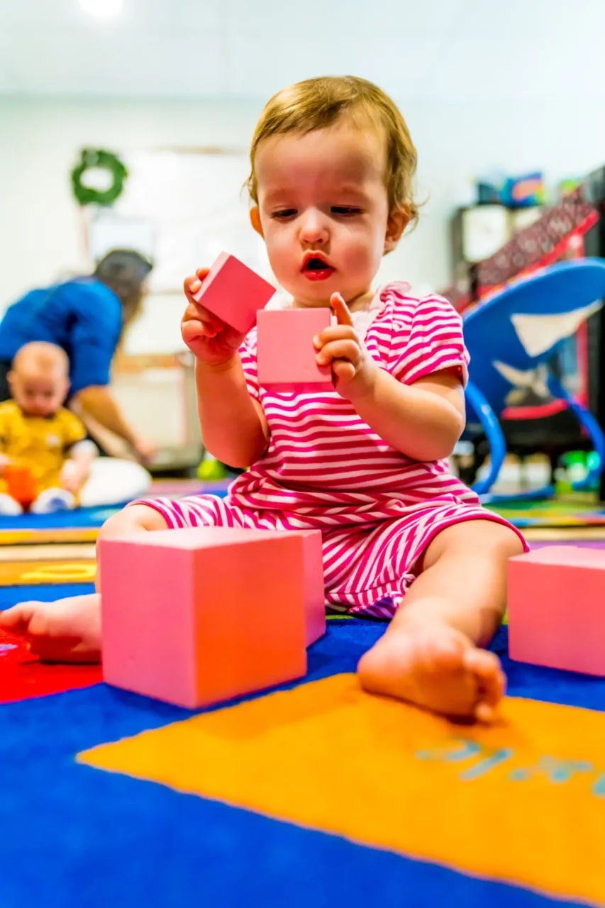 toddler playing with montessori materials