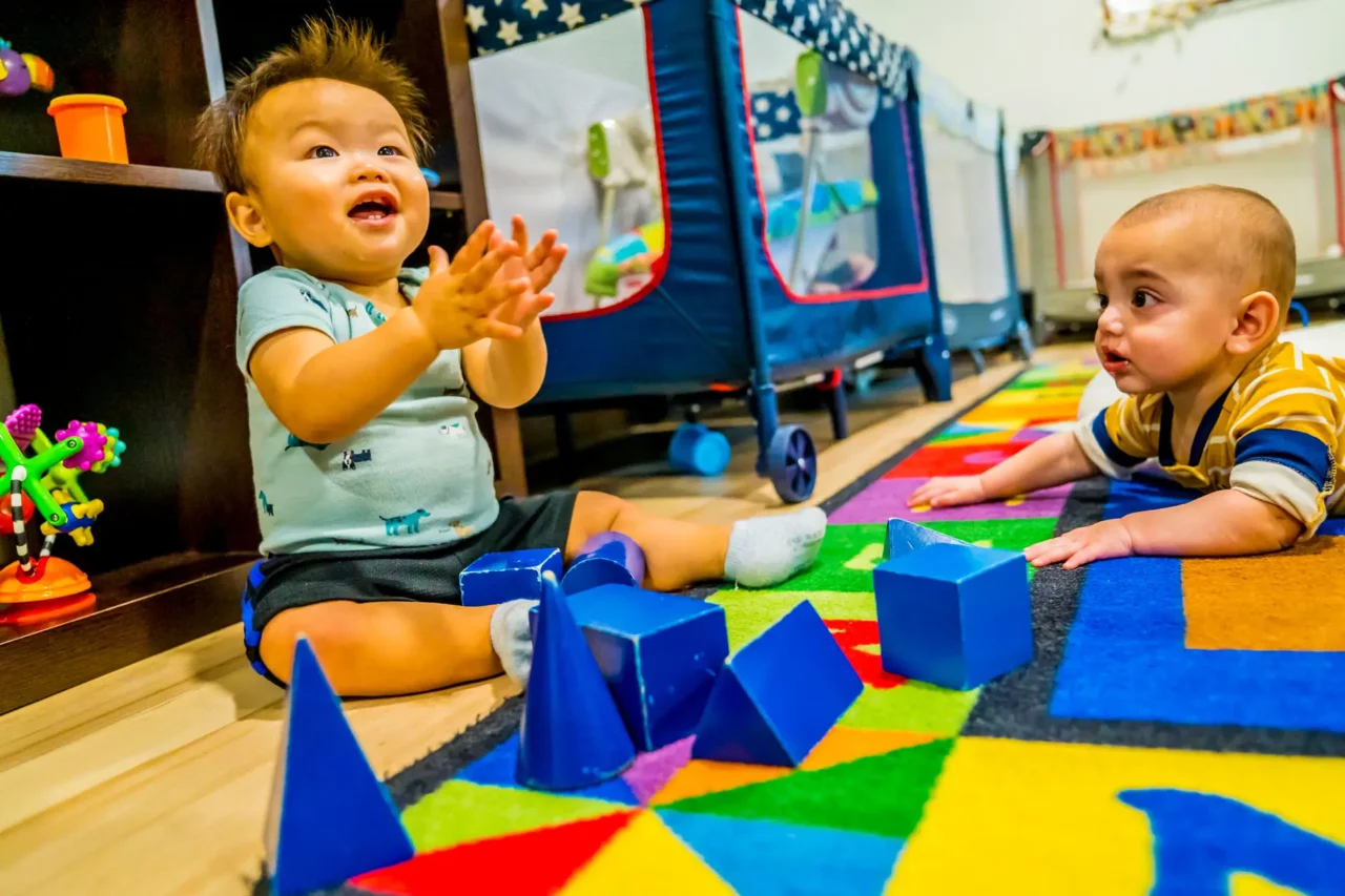 toddlers playing with montessori materials