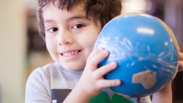 Child holding globe