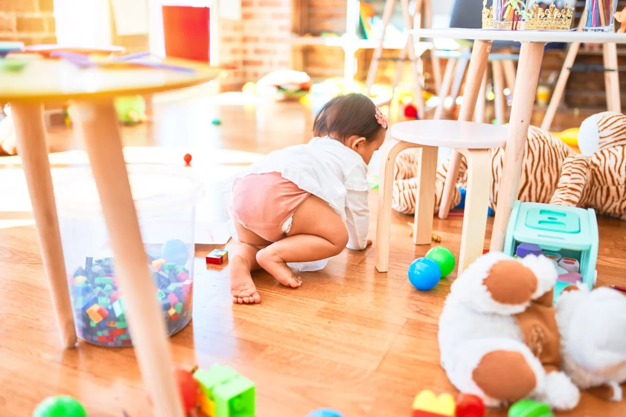 infant crawling on floor